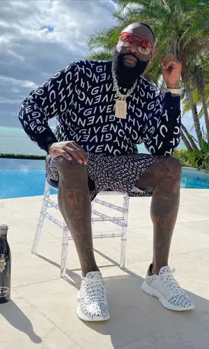 Rick Ross wearing Givenchy sweatshirt