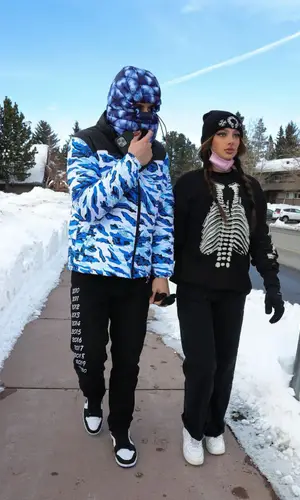 The Kid Laroi wearing Fuck The Population pants