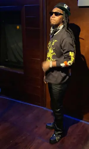 Takeoff wearing Nike sneakers