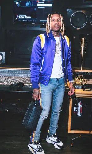 Lil Durk wearing Louis Vuitton bag