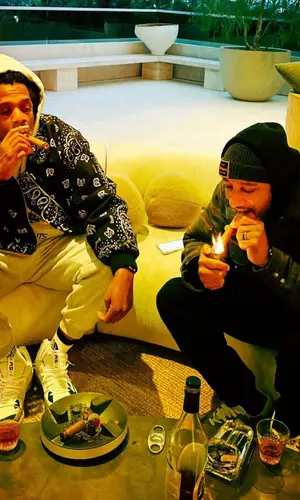Jay-Z wearing Rhude jacket