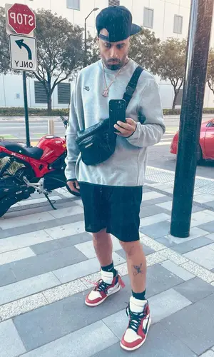 Nicky Jam wearing Nike jacket