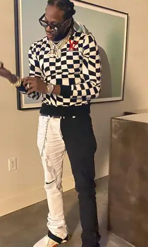 2 Chainz wearing Louis Vuitton sweatshirt