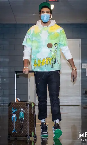 Jayson Tatum wearing Christos trousers