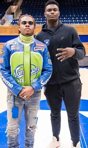 Gunna wearing Louis Vuitton wallet
