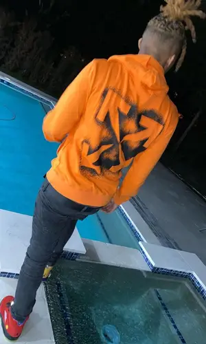 YNW Bortlen wearing Balmain jeans