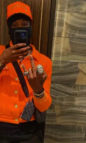 Meek Mill wearing Louis Vuitton bag