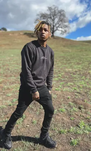 DDG wearing BooHooMan sweater