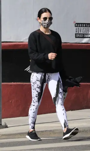 Lucy Hale wearing Athletic Propulsion Labs sneakers