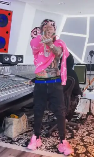6ix9ine wearing Balenciaga sweatshirt