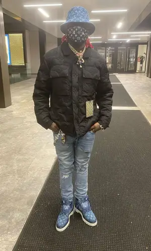 Sauce Walka wearing Louis Vuitton boots