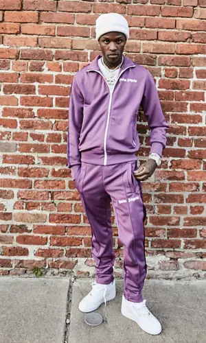Quando Rondo wearing Palm Angels jacket