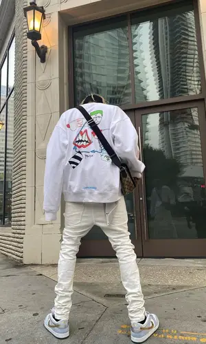 TheHxliday wearing Nike sneakers