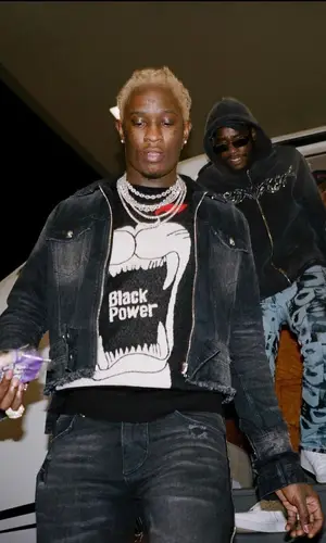Young Thug wearing Cease±Desist sweater