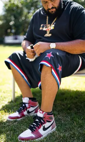 DJ Khaled wearing Louis Vuitton bag