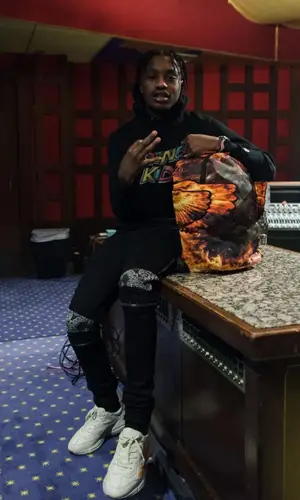 Lil Tjay wearing Sprayground backpack