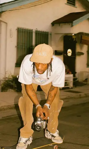 Travis Scott wearing Space Village cap