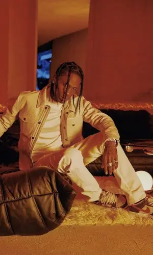 Travis Scott wearing Tom Ford sweater