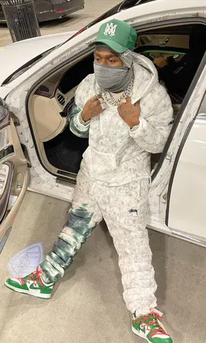 DaBaby wearing Nike jacket