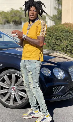 Yungeen Ace wearing Gucci shirt