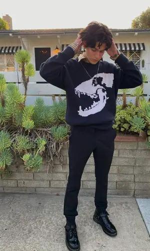 Lil Huddy wearing Dr. Martens boots