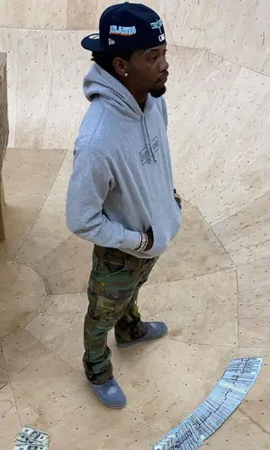 Offset wearing New Era cap