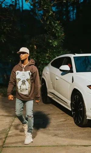 Toosii wearing Homme + Femme hoody