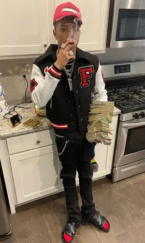 Lil Migo wearing Louis Vuitton sandal