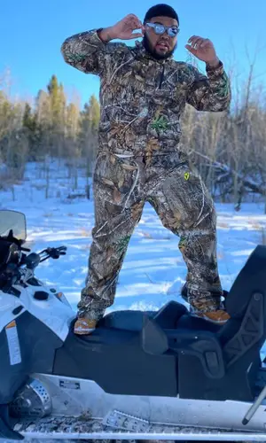 Druski wearing Realtree pants