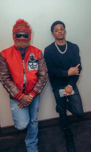 YK Osiris wearing Fendi sweatshirt