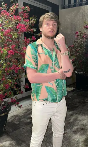 Murda Beatz wearing Amiri shirt