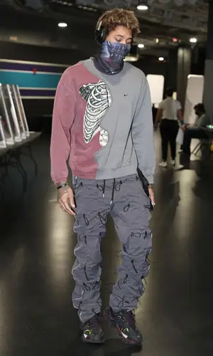 Kelly Oubre Jr wearing Defective Garments sweatshirt