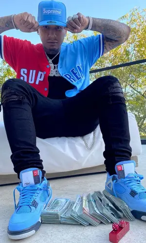 Moneybagg Yo wearing Supreme cap