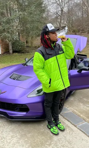 Lil Gnar wearing Gnarbar cap