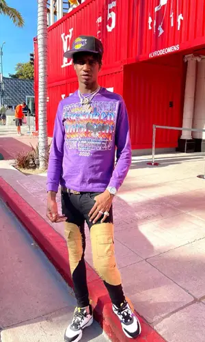 Yung Mal wearing New Era cap