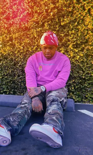 Mustard wearing Nike sneakers