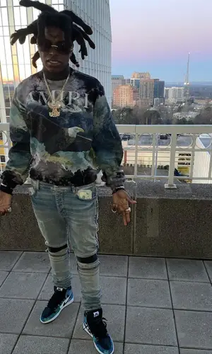 Kodak Black wearing Amiri sweatshirt