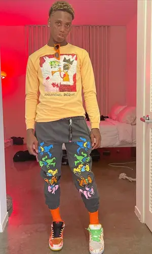 Famous Dex wearing Jean-Michel Basquiat sweatshirt
