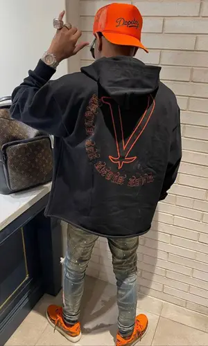 Lil Migo wearing Louis Vuitton backpack