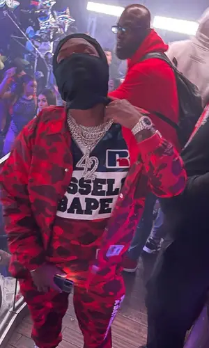 42 Dugg wearing Travis Scott Merch sock