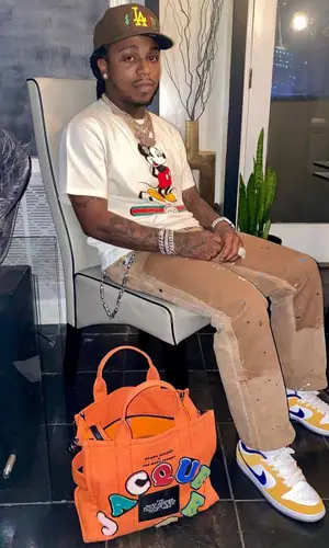 Jacquees wearing Marc Jacobs bag