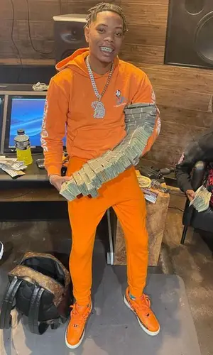 Lil Migo wearing Louis Vuitton backpack