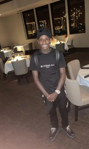 Quando Rondo wearing Louis Vuitton backpack