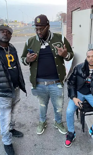 Peezy wearing Louis Vuitton belt