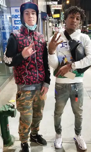 NBA YoungBoy wearing Purple Brand jeans