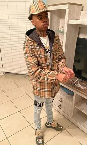 Lil Poppa wearing Burberry cap