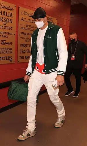 Kyle Kuzma wearing Louis Vuitton bag