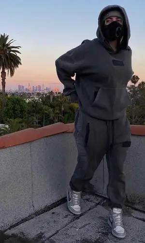 Billie Eilish’s Outfit in Jordan Hoodie, Nike Sneakers & Dior (2020)