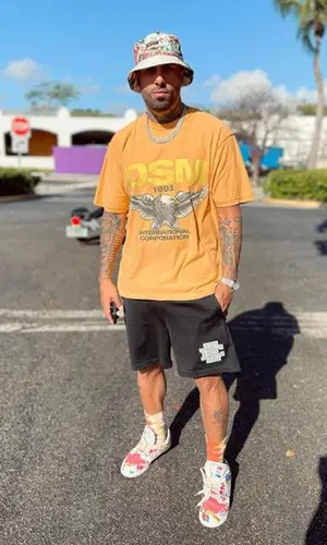 Nicky Jam wearing XLARGE hat