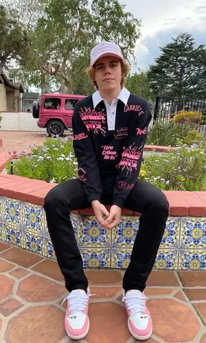 The Kid Laroi wearing Chanel shirt